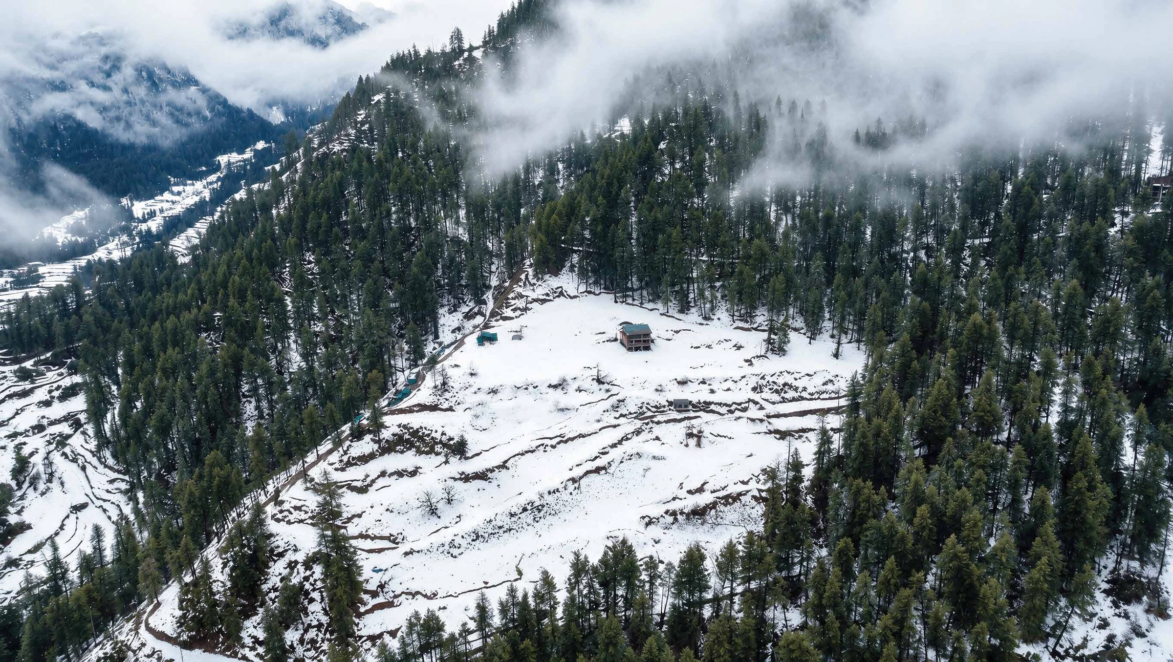 Abhinandan Lodha Shimla - The Ridge site under winter snow, ringed by protected deodar forest